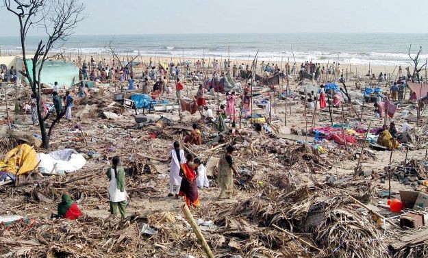 People looking for their belongings on Chennai Marina beach after the 